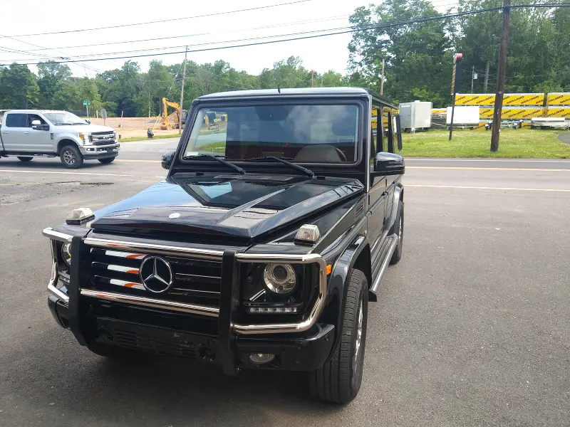 Black Mercedes G‑Wagon angled right — ceramic coating car results