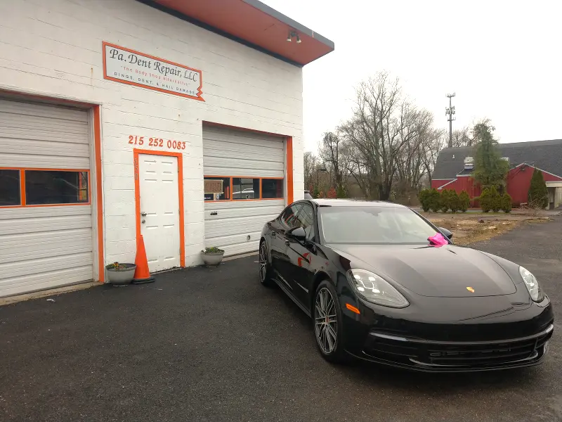 Black Porsche angled left — ceramic coating showcase
