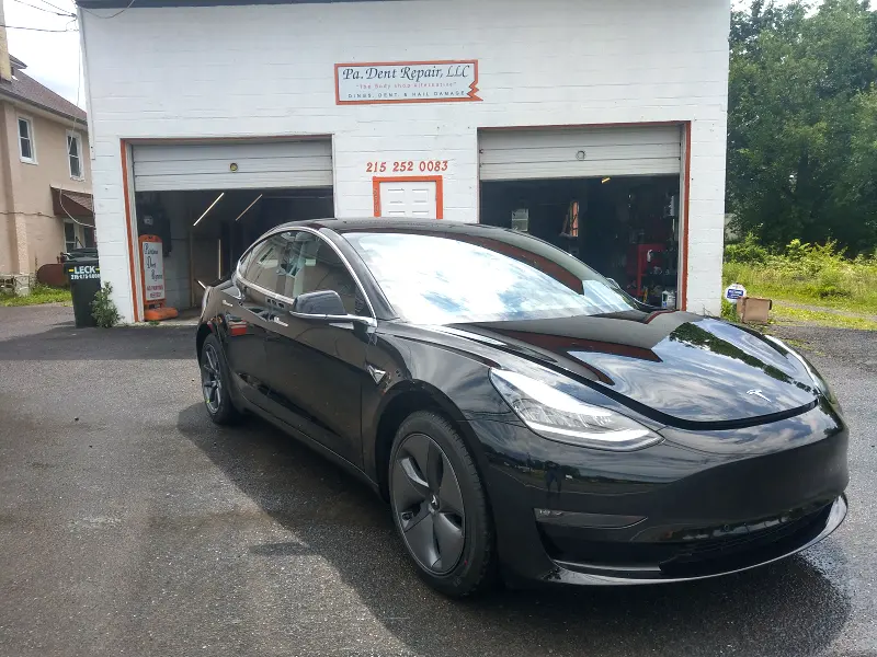 Black Tesla angled right — ceramic coating car results