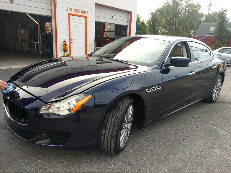 Dark blue Maserati sedan angled right — ceramic coating car results