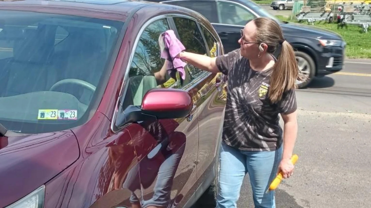 How to wash a car without damaging the paint: technician using safe, swirl-free methods in Bucks County