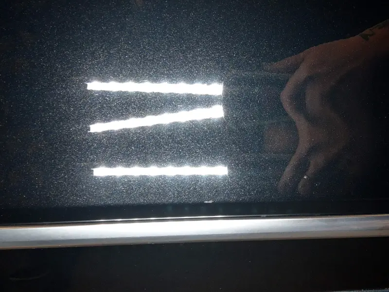 Closeup of corrected Cadillac passenger door with swirl marks removed