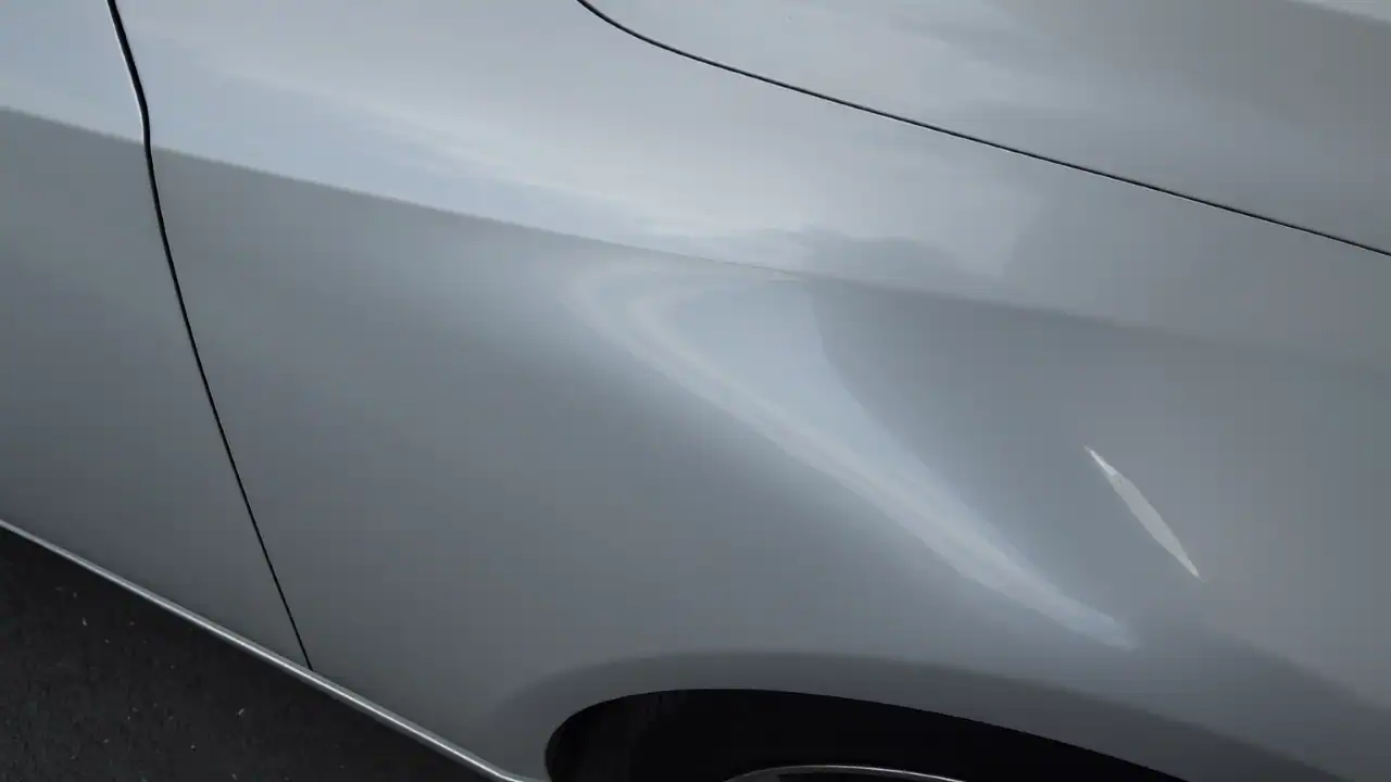 After‑repair photo of a Lexus fender kink restored with paintless dent repair.
