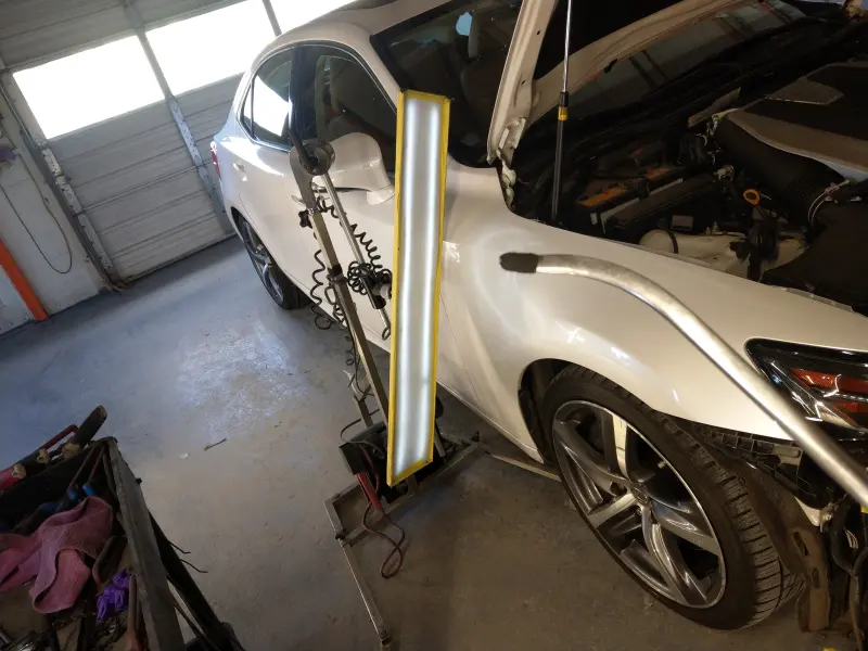 PDR tool used during the Lexus fender dent repair spotlight, showing the specialized equipment required for precise paintless dent repair.